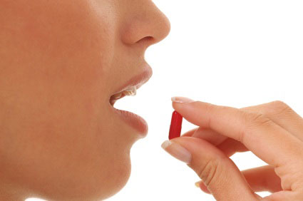woman consuming a pill 2